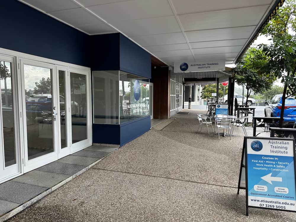 The outside of the Australian Training Institute Campus in Albion with a sandwich board by the road.